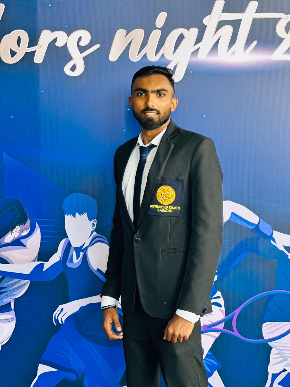 Portrait of Rithurshan Elankeeran, President of the Tamil Student Association, smiling and wearing formal attire, standing in a university or event setting. If visible, text in the image: Rithurshan Elankeeran President. The atmosphere is welcoming and professional.