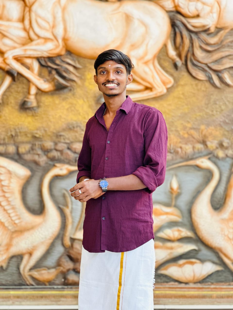 Portrait of Ramachandran Sweeskaran, Vice Secretary of the Tamil Student Association, smiling and wearing formal attire, standing in a university or event setting. If visible, text in the image: Ramachandran Sweeskaran Vice Secretary. The atmosphere is welcoming and professional.